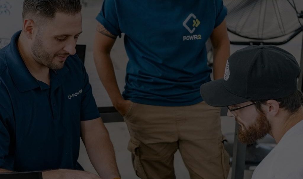Powr2-background A background image for POWR2 of repair workers on the job