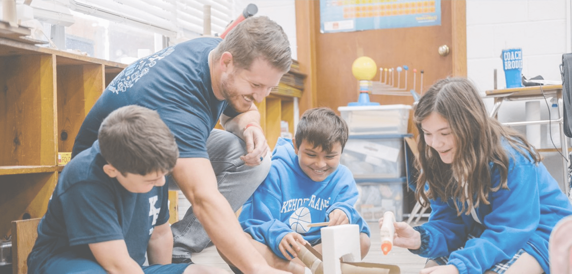 ISP-hero Children talk with their teacher in school