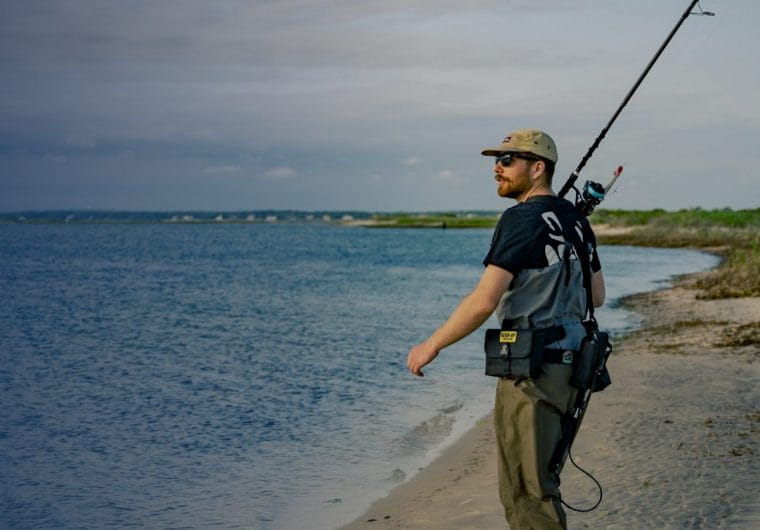 j&h tackle background A man with a fishing rod